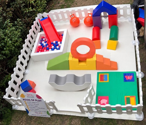 Full mini park with hoop obstacle, slide, ball pit and sensory mat in a garden set-up