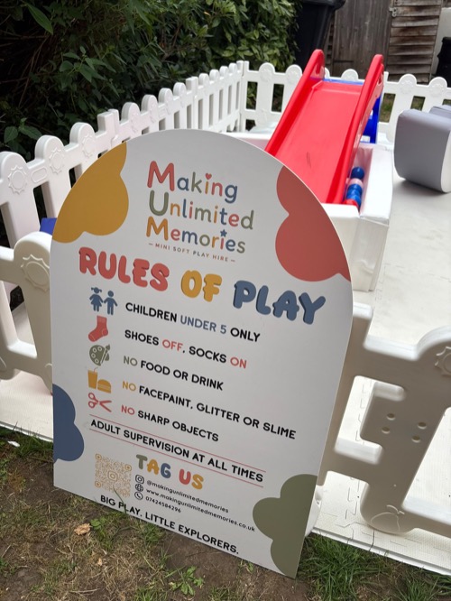 M.U.M rules of play sign in front of a garden mini park set-up