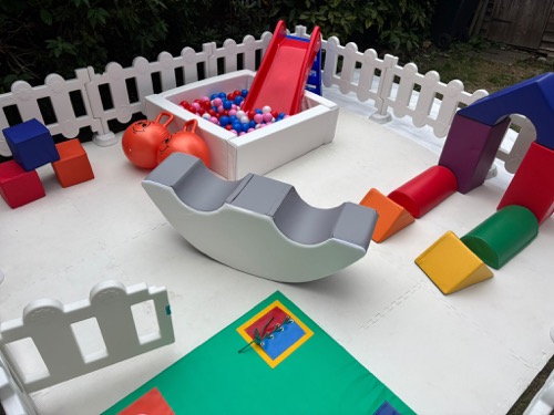 Ball pit and soft play blocks in a garden mini park set-up